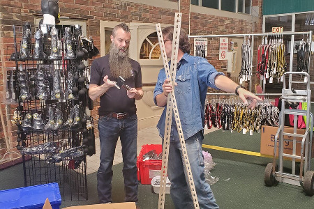 Stan part owner of EM City and Markus setting up the booth at Oklahoma Leatherfest 202