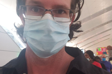 Markus waiting to board the plane and start his journey.